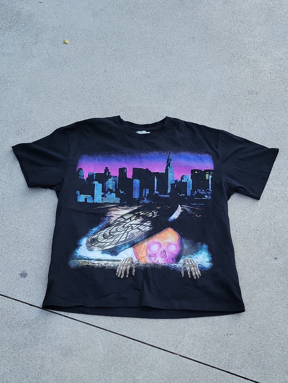 Black Short-Sleeve Graphic Tee with Neon Skyline and Skull Artwork